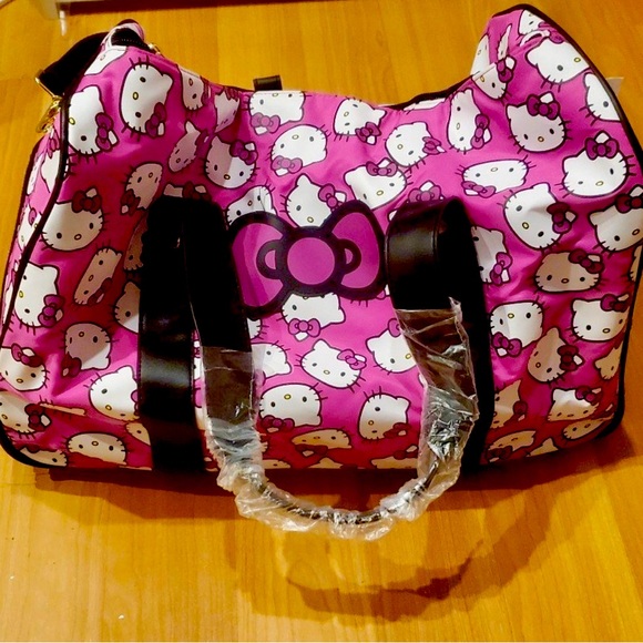 Hello Kitty Handbags - NEW! Hello Kitty Hot Pink Rolling Duffel Luggage Bag Suitcase NWT